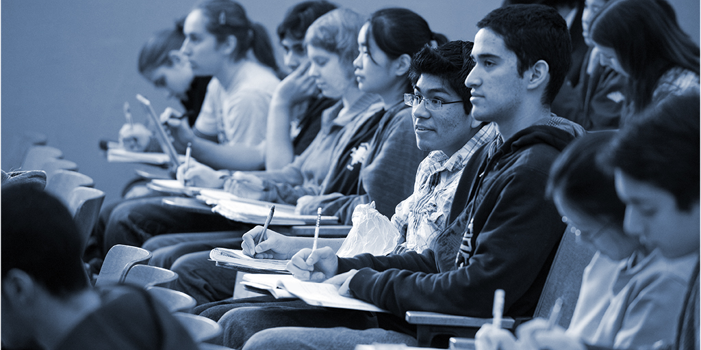 A row of students sitting at desks