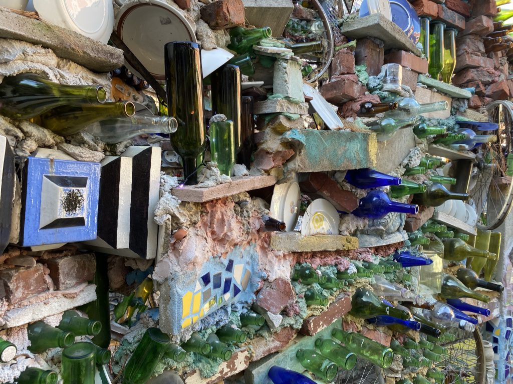 wall at Philadelphia's Magic Gardens: mosaic w/ bottles and found ceramic shards