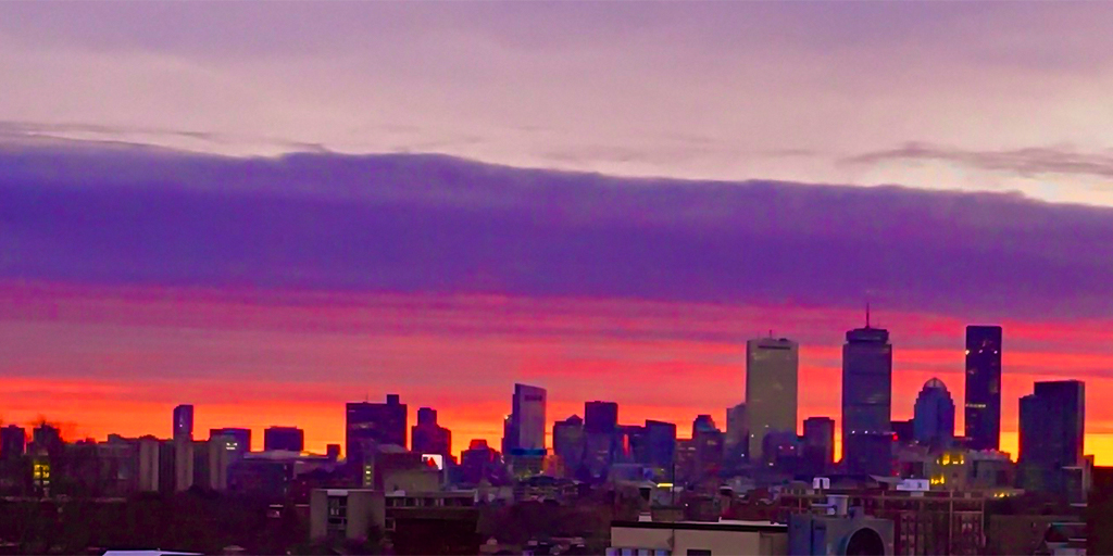Dramatic sunrise over Boston skyline